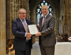 John Barker receiving the award from HRH Prince Andrew. Photo courtesy of Buckingham Palace.